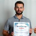 Trainer holding certificate