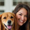 Client smiling with well-behaved dog